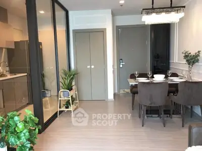 Modern dining area with open kitchen and elegant decor