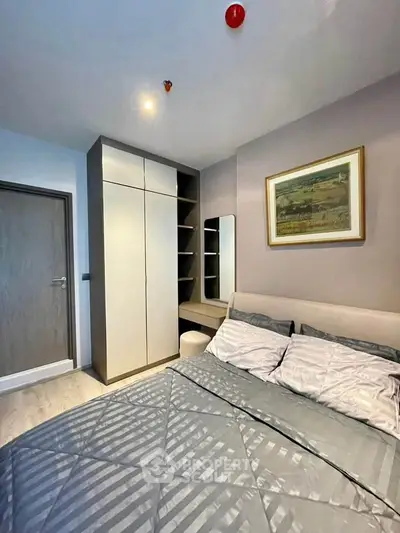 Modern bedroom with stylish decor and built-in wardrobe