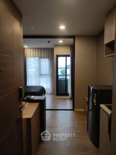 Modern apartment interior with cozy bedroom and balcony view