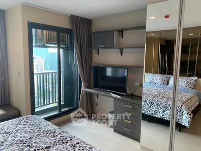 Modern bedroom with balcony view and stylish decor in urban apartment