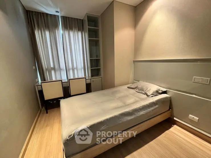 Cozy modern bedroom with natural light and stylish furnishings
