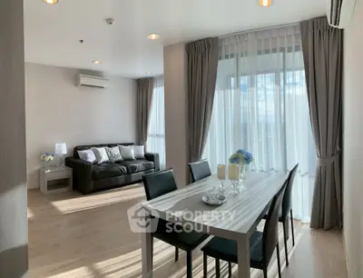 Spacious modern living room with elegant dining area and natural light