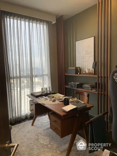 Elegant study room with modern wooden desk and floor-to-ceiling window view