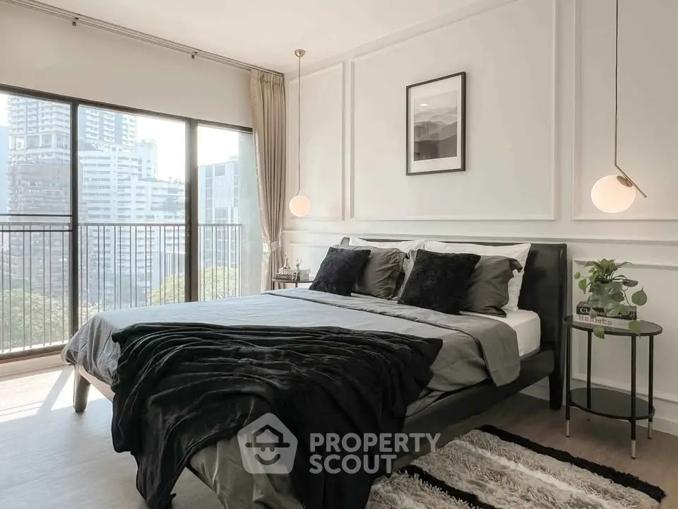 Modern bedroom with large window and stylish decor in urban apartment