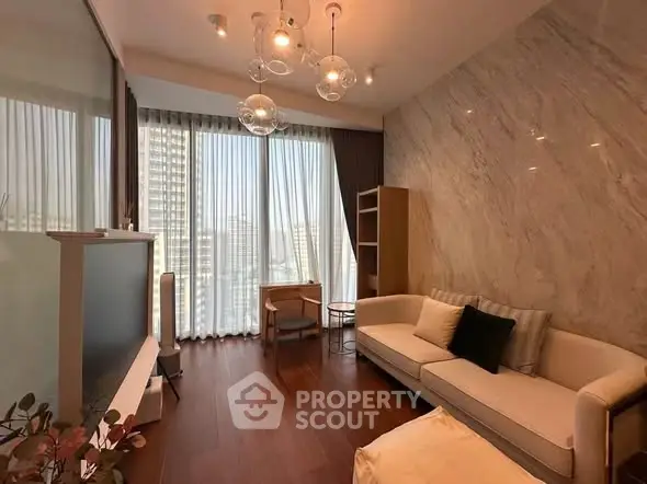 Luxurious living room with floor-to-ceiling windows and elegant decor