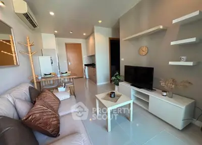 Modern living room with sleek furniture and open layout, perfect for contemporary living.