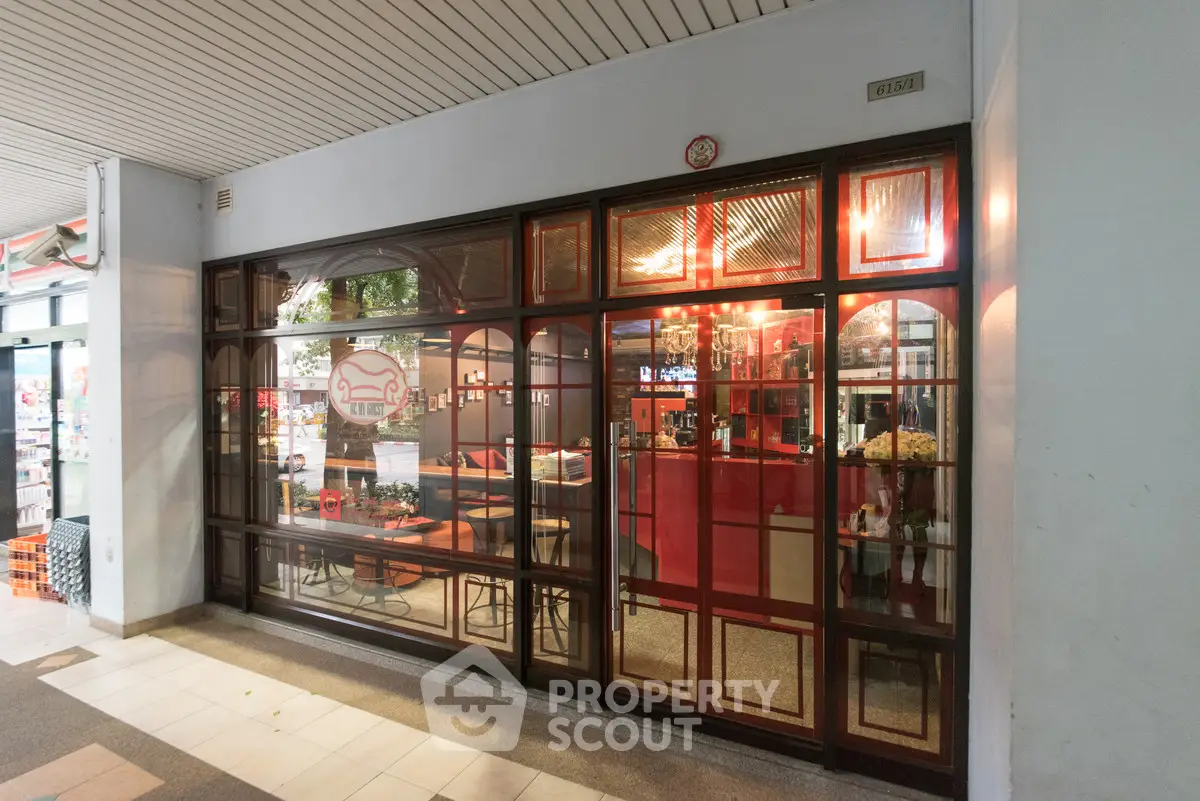 Charming restaurant exterior with inviting red and wood accents, perfect for dining and socializing.