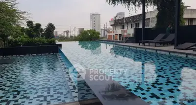 Luxurious outdoor pool with modern design and serene surroundings.