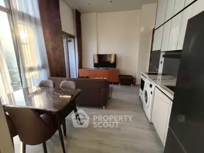 Modern living room with sleek furniture and in-unit washing machine, perfect for urban living.