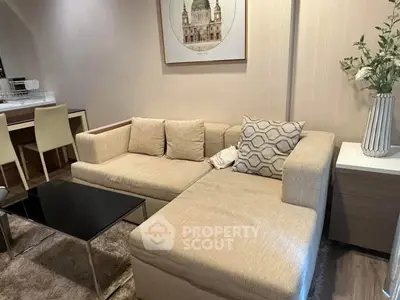 Cozy living room with beige sectional sofa and modern decor