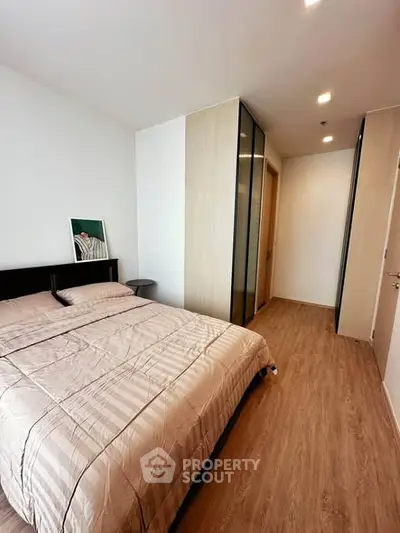 Modern bedroom with sleek design and ample natural light