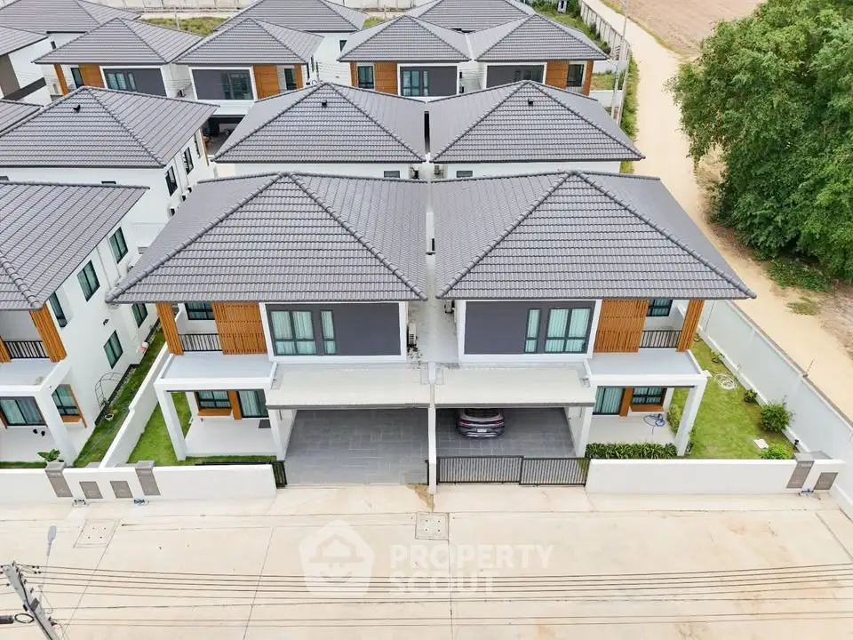 Modern residential complex with stylish two-story houses and well-maintained surroundings.
