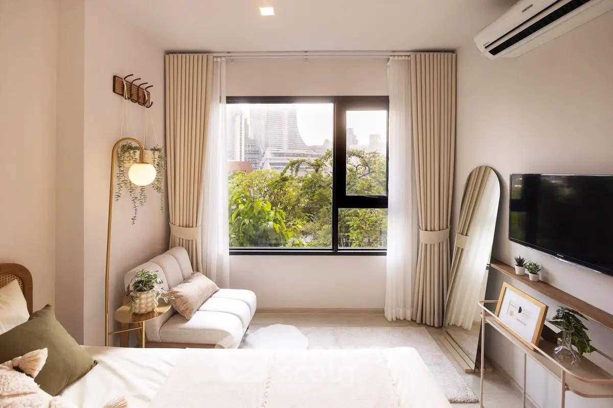 Chic bedroom with city view, modern decor, and natural light