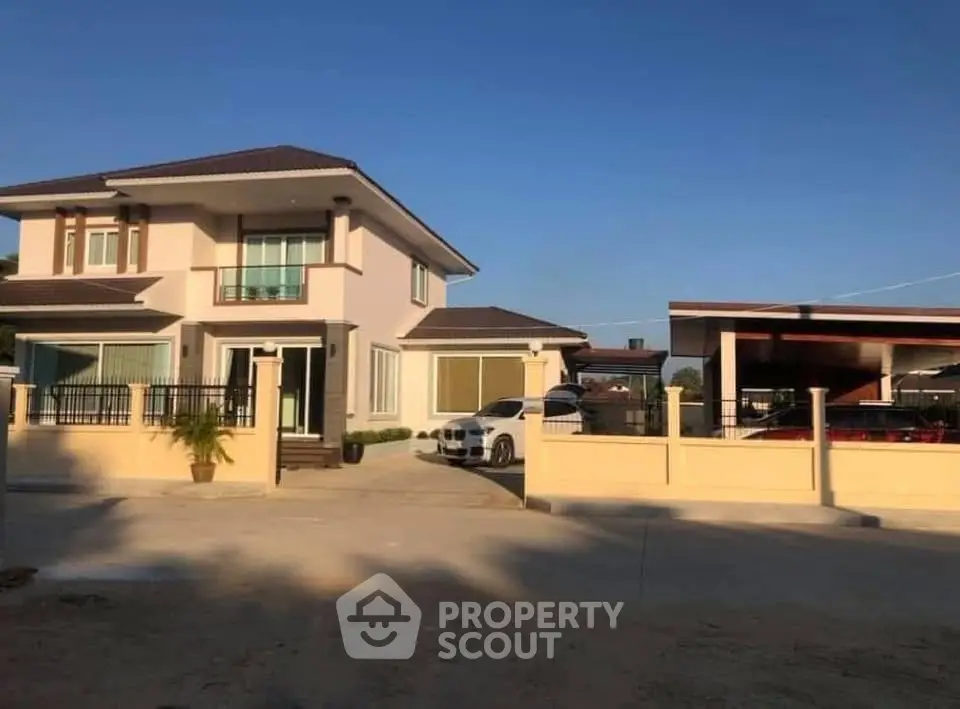 Spacious two-story house with modern design and ample parking space in a serene neighborhood.