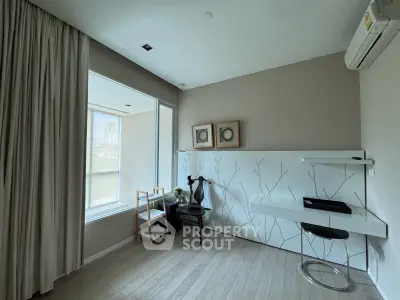 Modern study room with stylish decor and large window offering natural light