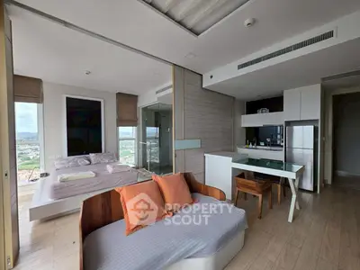 Modern studio apartment with open layout and scenic view