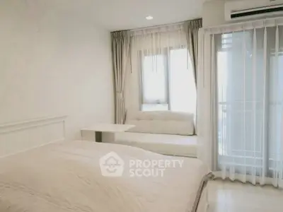 Bright and airy bedroom with large windows and modern decor