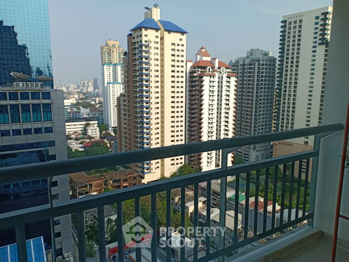 Stunning cityscape view from high-rise balcony in urban setting