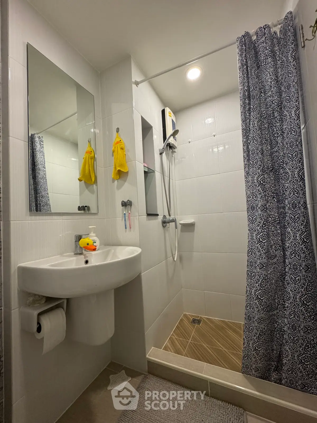 Modern bathroom with shower and sink in a cozy apartment