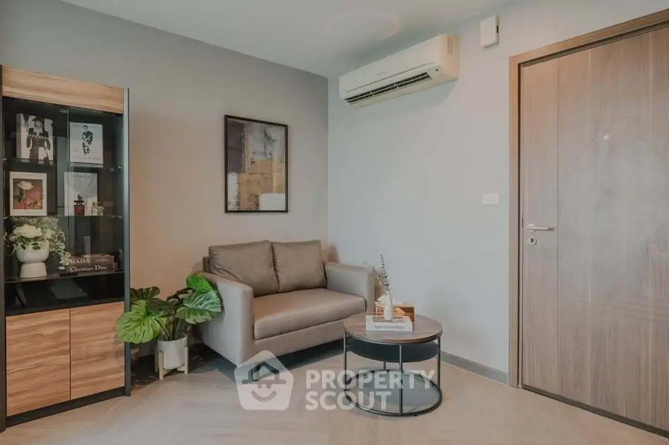Modern living room with stylish decor and air conditioning, perfect for cozy relaxation.