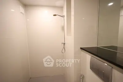 Modern minimalist bathroom with sleek shower and elegant fixtures