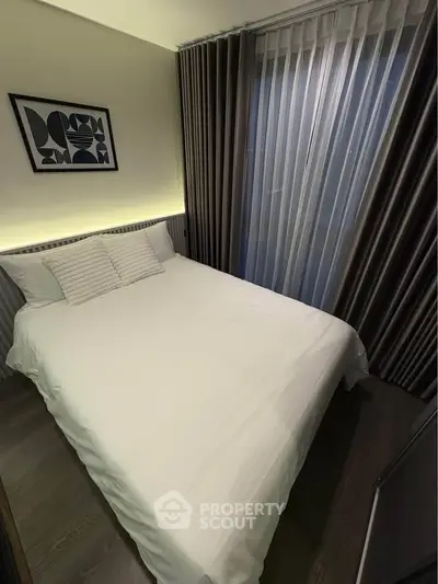 Cozy modern bedroom with stylish decor and soft lighting, perfect for relaxation.