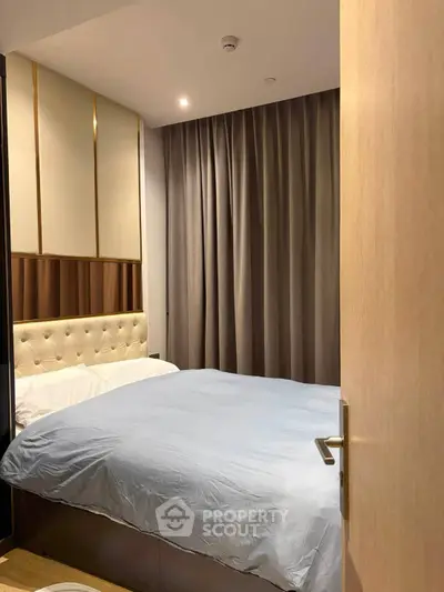 Cozy modern bedroom with elegant decor and plush bedding