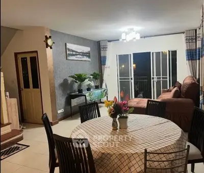 Spacious living room with elegant decor and large windows for natural light.