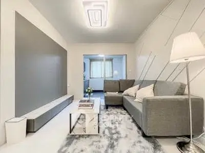 Modern living room with stylish gray sofa and chic decor