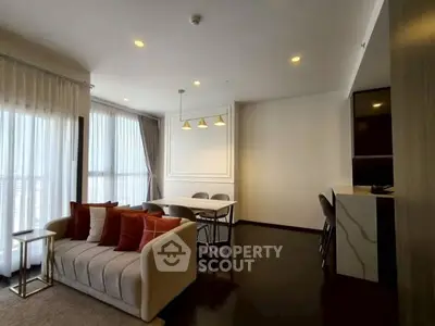 Modern living room with elegant decor and dining area in a stylish apartment