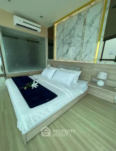 Luxurious bedroom with elegant marble accents and modern decor