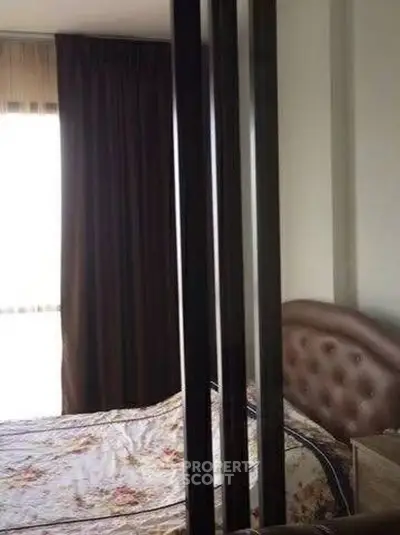 Cozy bedroom with floral bedding and elegant headboard