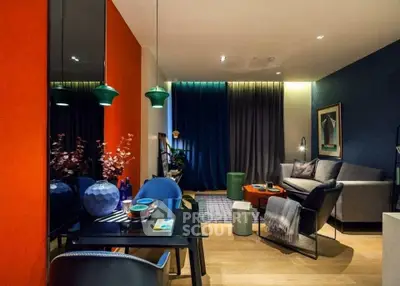 Stylish modern living room with vibrant decor and cozy seating area.