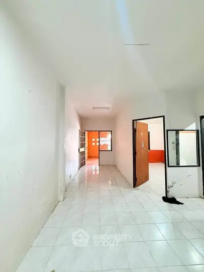 Spacious interior with tiled flooring and open layout, ideal for customization and modern living.