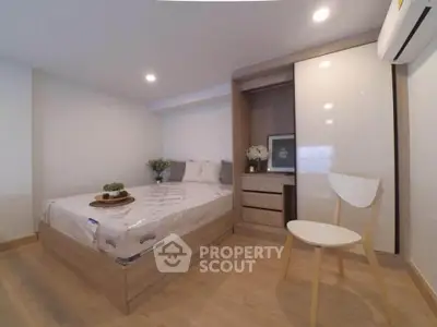 Modern bedroom with minimalist design and wooden furniture