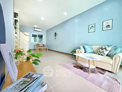 Spacious living room with modern decor and natural light