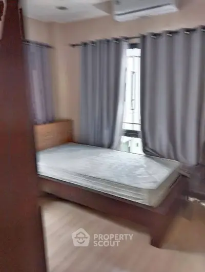 Cozy bedroom with natural light and modern furnishings