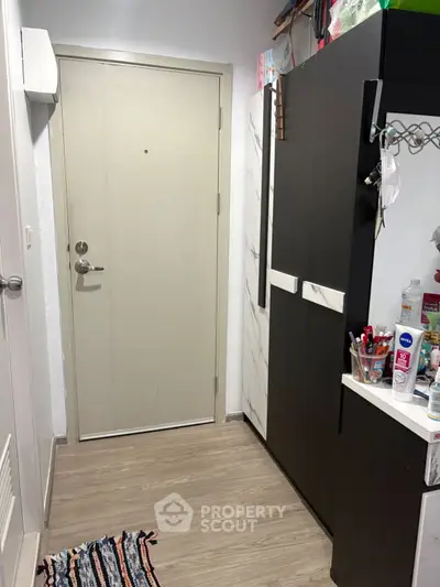 Compact entryway with modern storage solutions and stylish decor