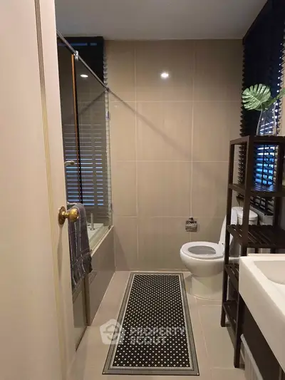 Modern bathroom with sleek design and glass shower enclosure