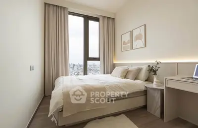 Modern bedroom with city view, elegant decor, and natural light.