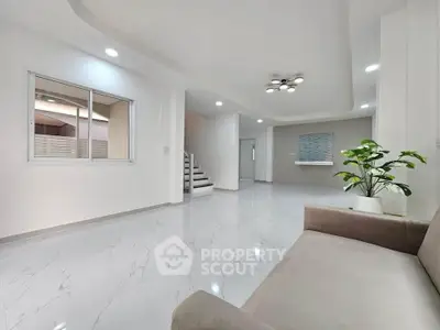 Spacious modern living room with elegant flooring and stylish lighting