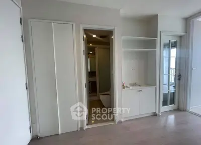 Modern apartment interior with sleek bathroom and storage space