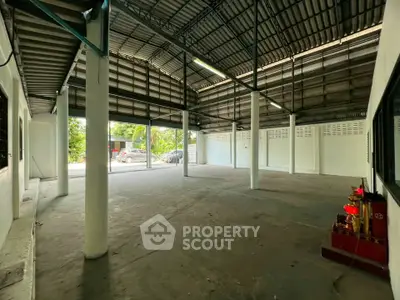 Spacious industrial warehouse with high ceilings and ample natural light