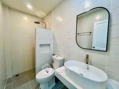 Modern bathroom with sleek fixtures and stylish tile design