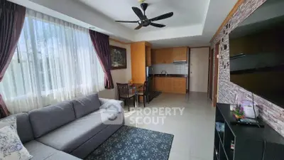 Spacious living room with modern kitchen and large window