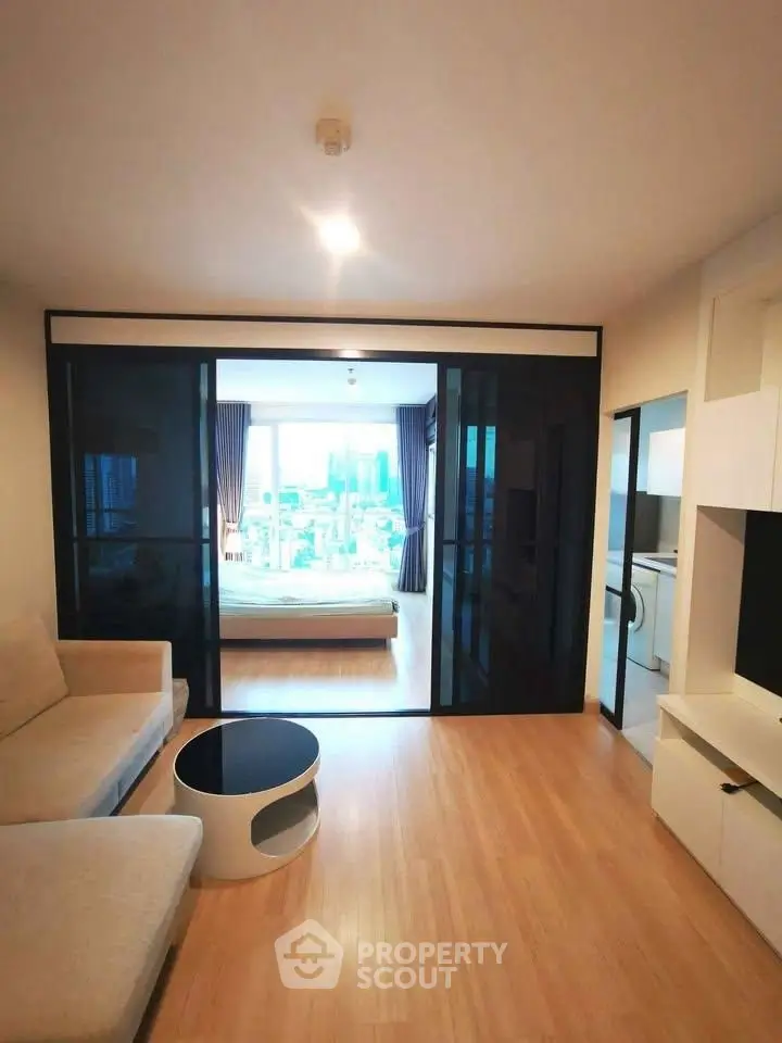 Modern living room with sliding glass doors and city view