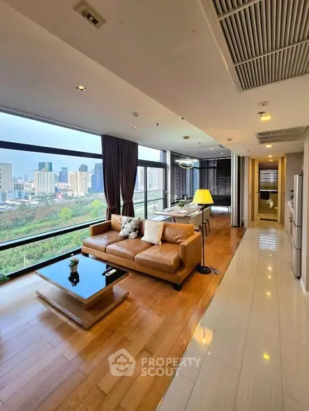 Luxurious high-rise living room with stunning city view and modern furnishings.