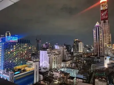 Stunning cityscape view showcasing vibrant skyscrapers and urban lights at night.
