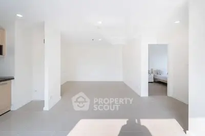 Spacious open-plan living area with natural light and modern finishes