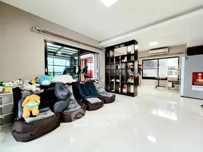Spacious living room with modern decor and plush seating in a bright, open layout.